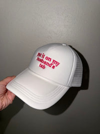 Put It On My Husband’s Tab Mesh Trucker Cap